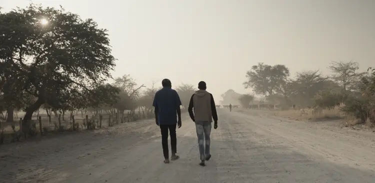 2young men walking in the shangombo town